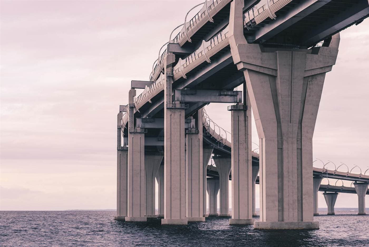 Coastal concrete bridge with blue water and sky